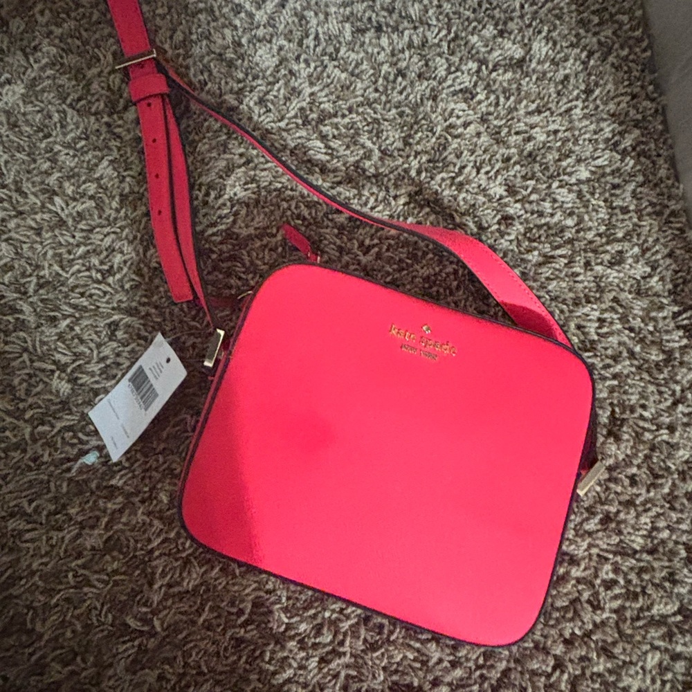 Kate Spade Newbury Lane Cammie Crossbody in a geranium pink color